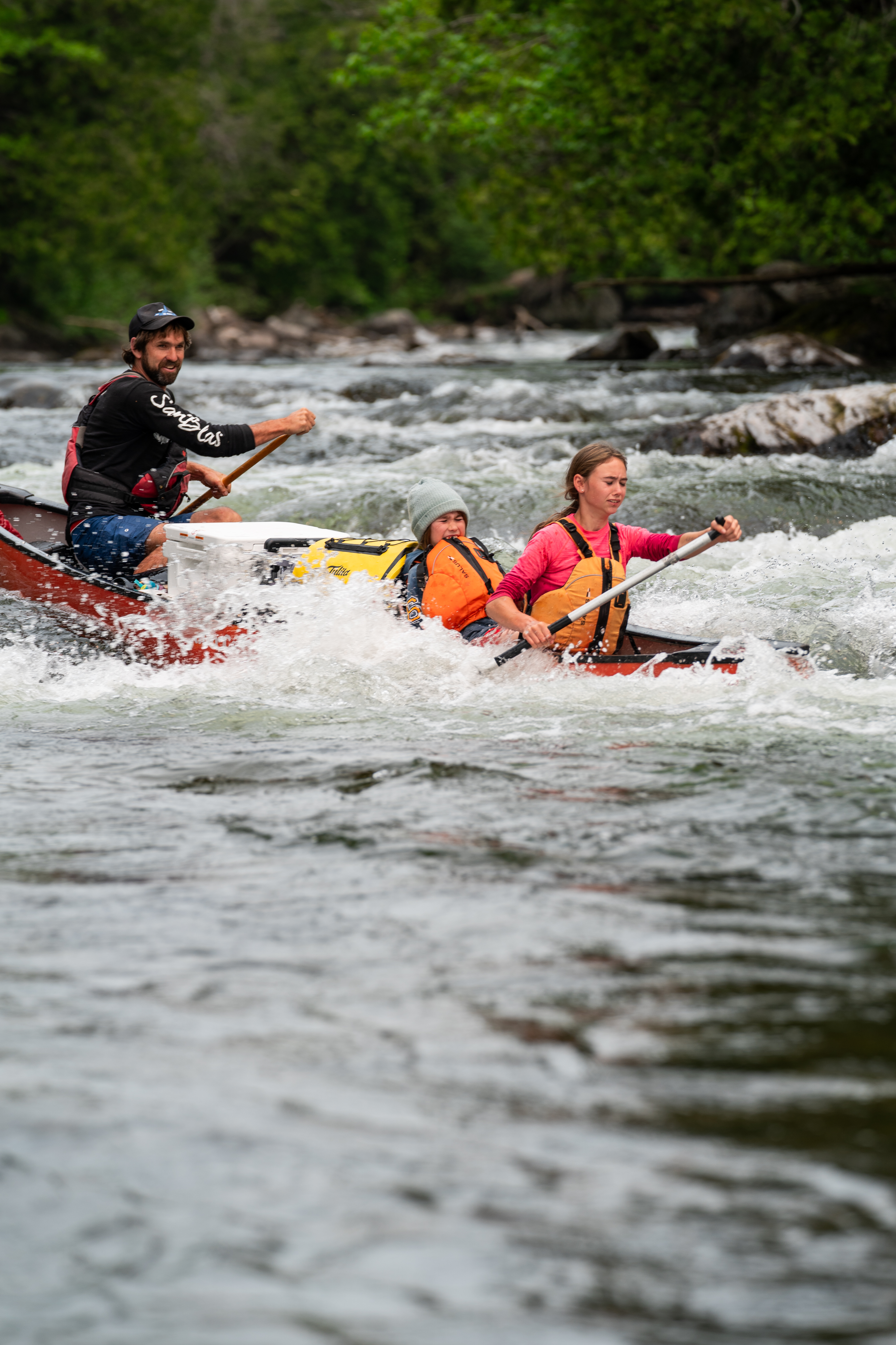 people whitewater canoeing down the Temagami River