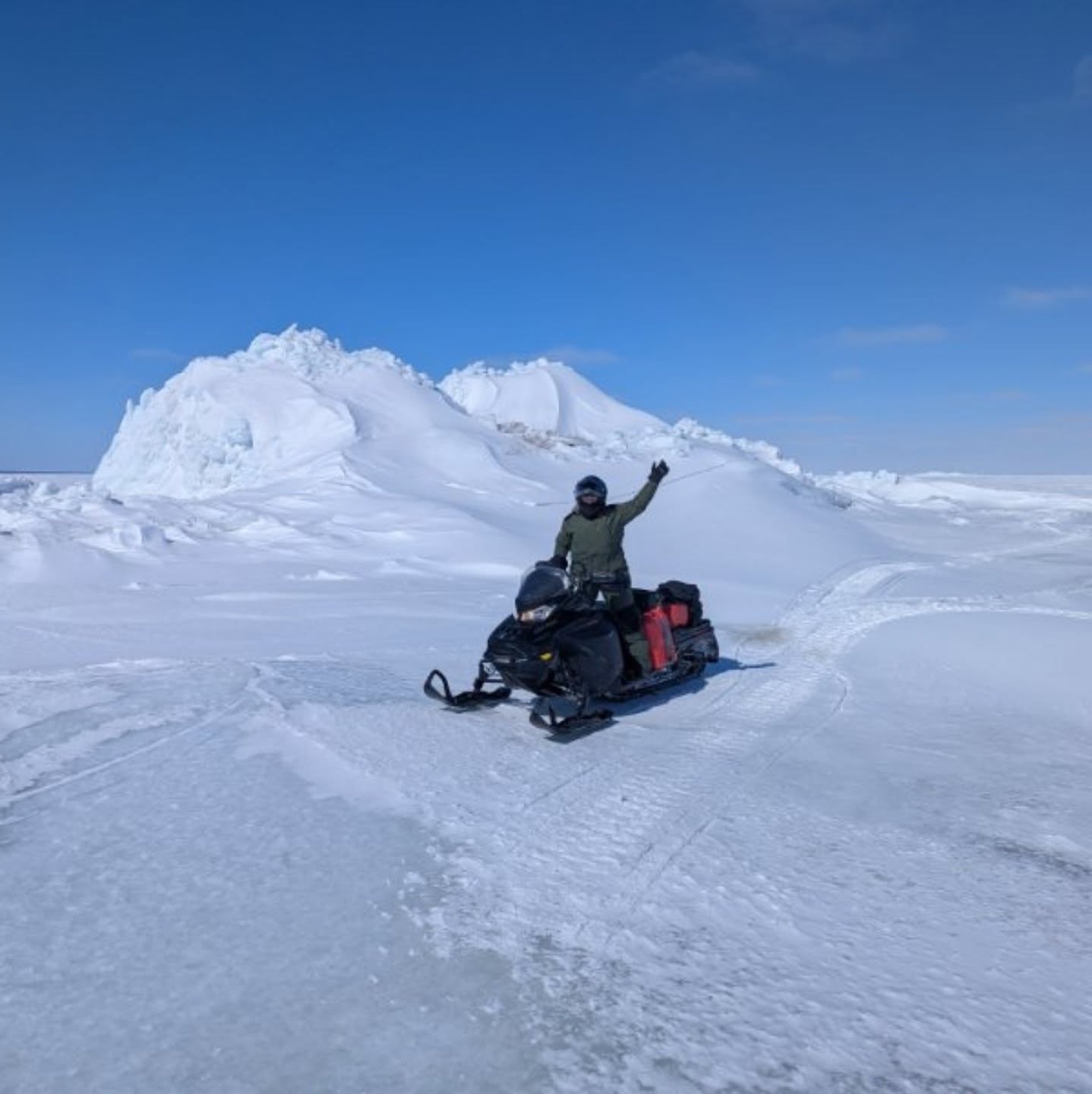 James Baie woman on snowmobile surrounded by snow
