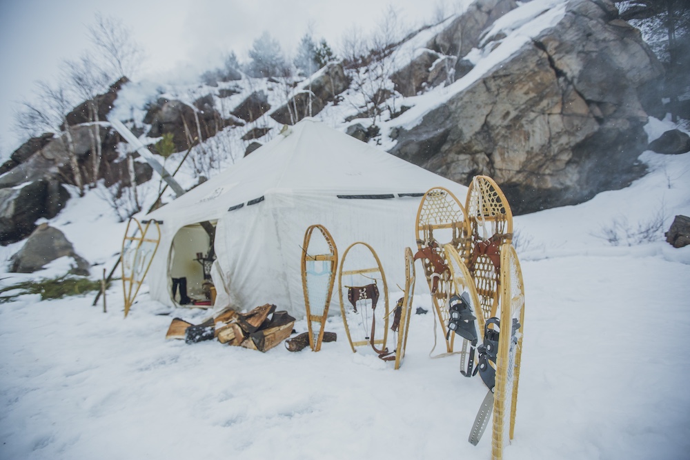 Traditional snowshoes outside of a hot tent in the winter