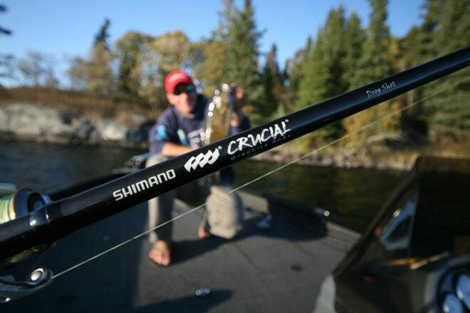The author with one of his fishing rods, or fishing poles as some call them