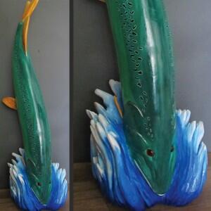Beautifully painted muskie by Carol Henderson sits at the entrance to the LOWS Museum