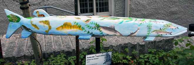 This muskie was created from a single jackpine log using a chain saw to rough out the shape.