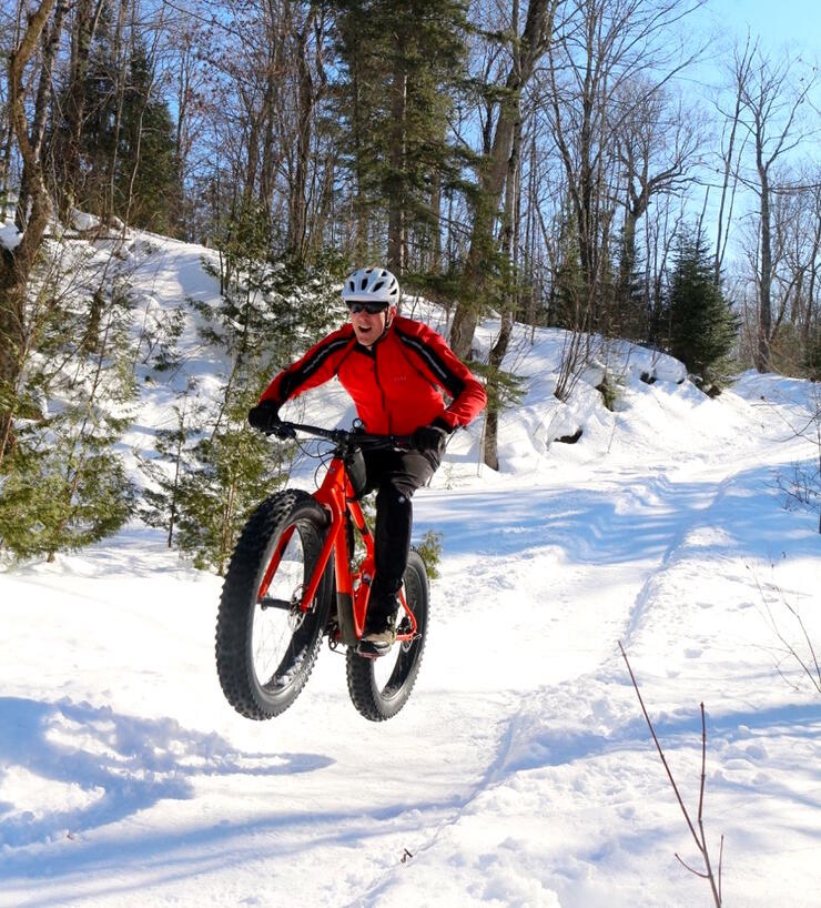Man riding on fat bike in winter