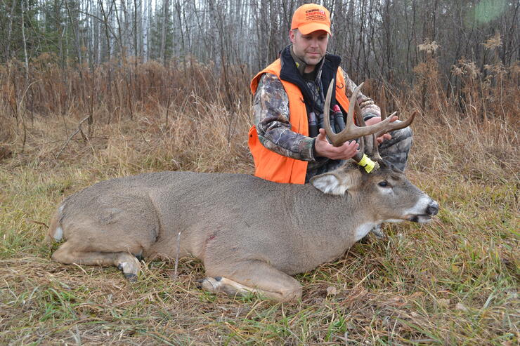 hunter with harvested deer