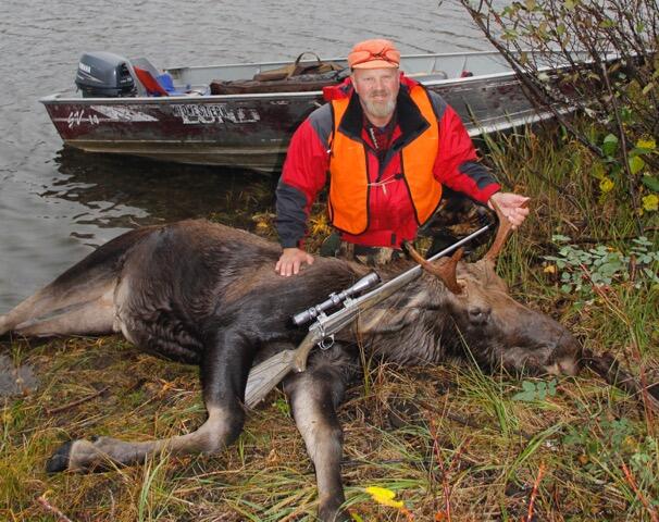 hunter with harvested moose