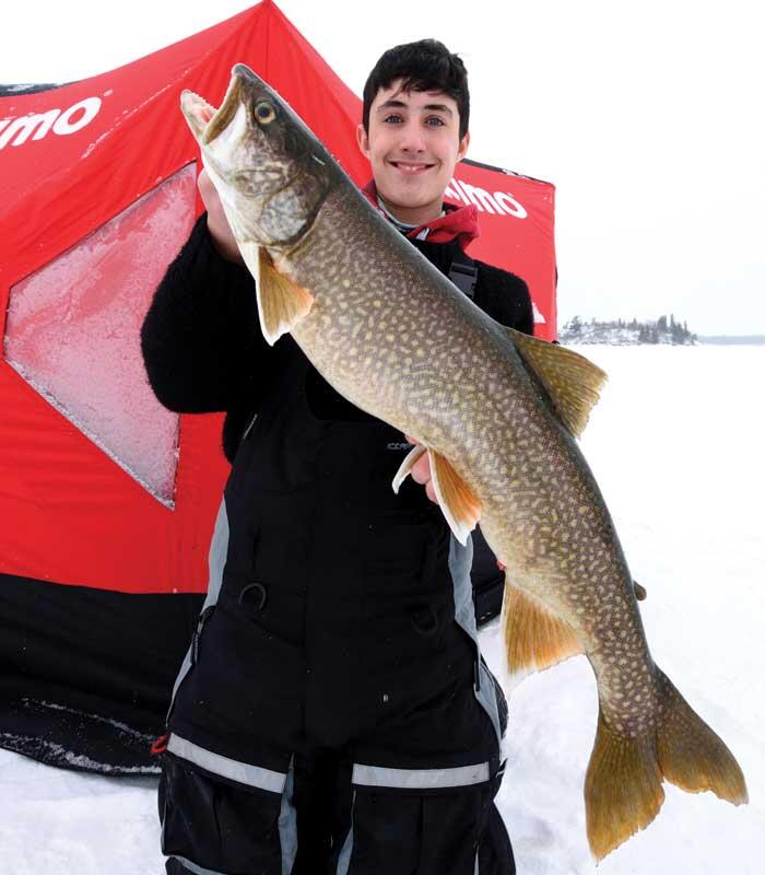 young angler with lake trout