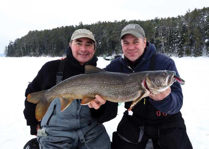 2 anglers with lake trout