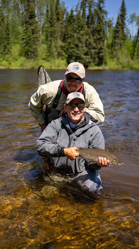 2 anglers fishing for whitefish